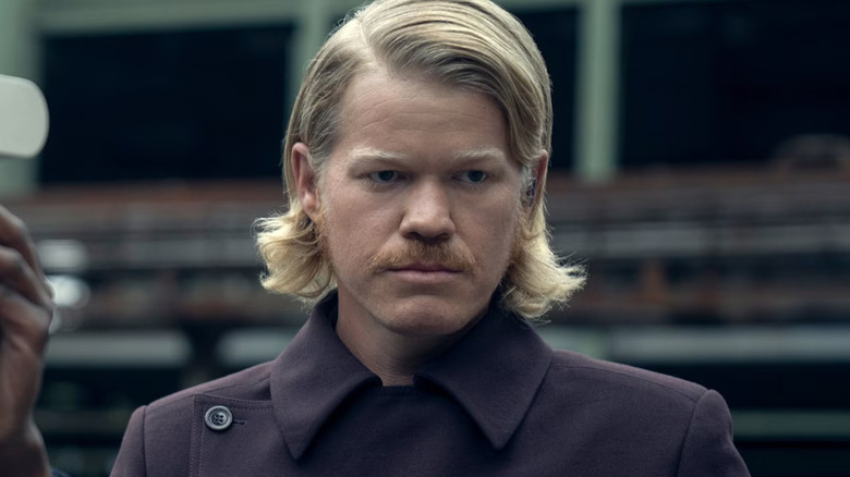 Plutarch looking at someone in The Hunger Games: Sunrise on the Reaping