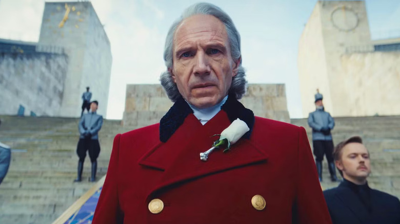 President Snow on the Capitol steps in a red jacket in The Hunger Games: Sunrise on the Reaping