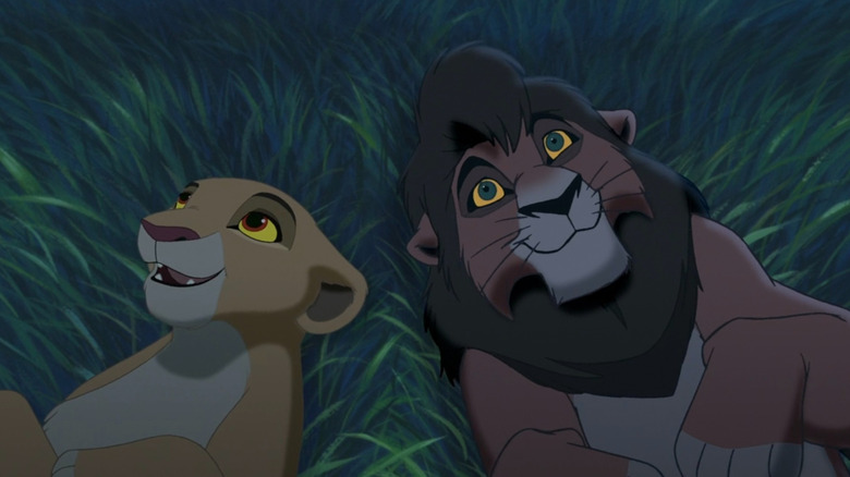 Kiara and Kovu lying in the grass together in The Lion King II: Simba's Pride