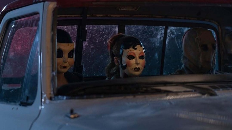 Killers sitting in car in The Strangers: Chapter 3