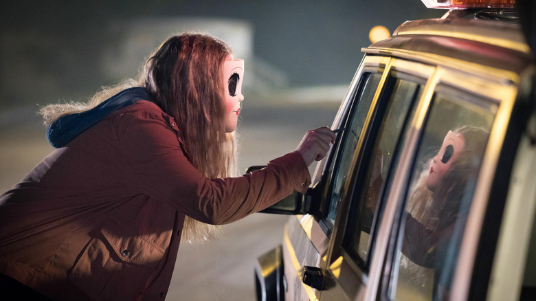 Dollface outside car in The Strangers: Prey at Night