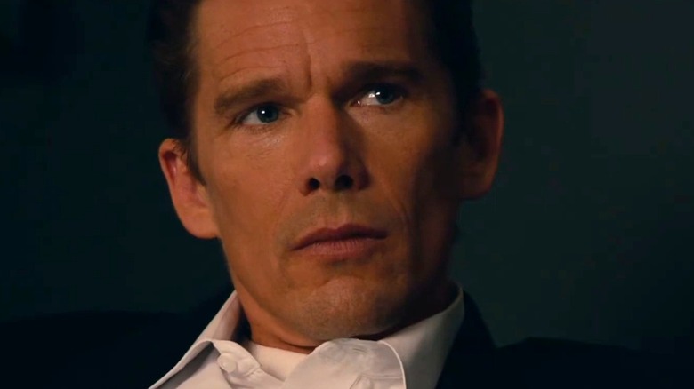 James Sandin watching the Emergency Broadcast Alert in The Purge