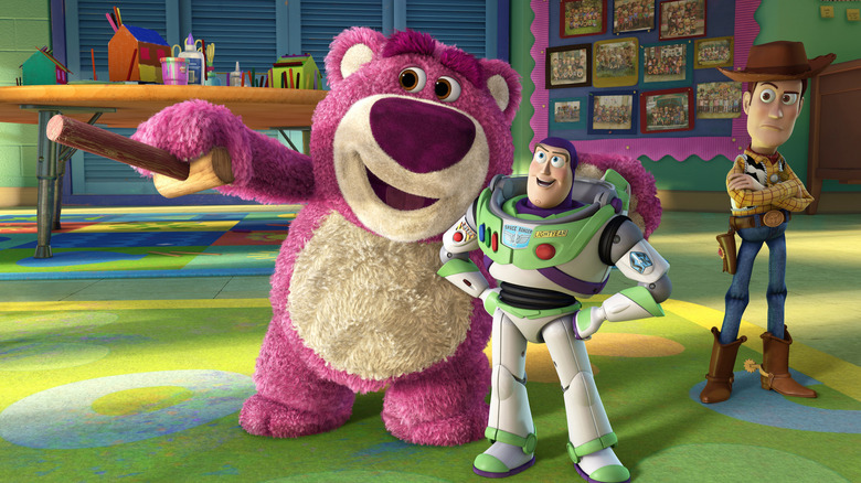 Lotso getting chummy with Buzz while Woody judges in "Toy Story 3" (2010)
