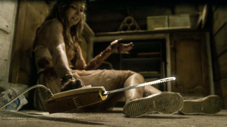 Natalie finds a chainsaw in Evil Dead (2013)