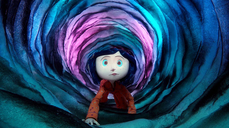Coraline crawling through tunnel to other world