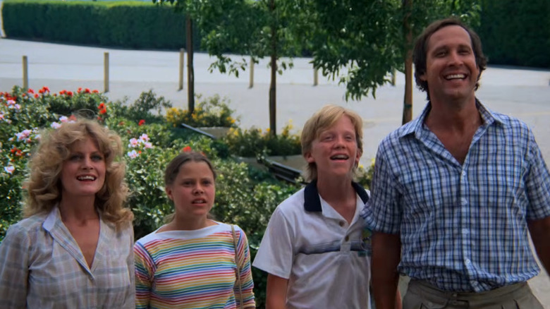 The Griswolds standing outside of Walley World in National Lampoon's Vacation