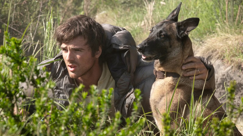 Hig and dog Jasper hiding out from scavengers in The Dog Stars (2026)
