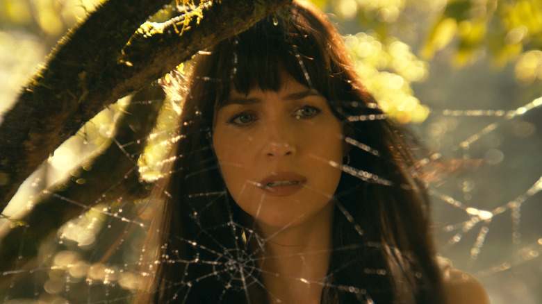 Cassie looking through a spider web in Madame Web (2024)
