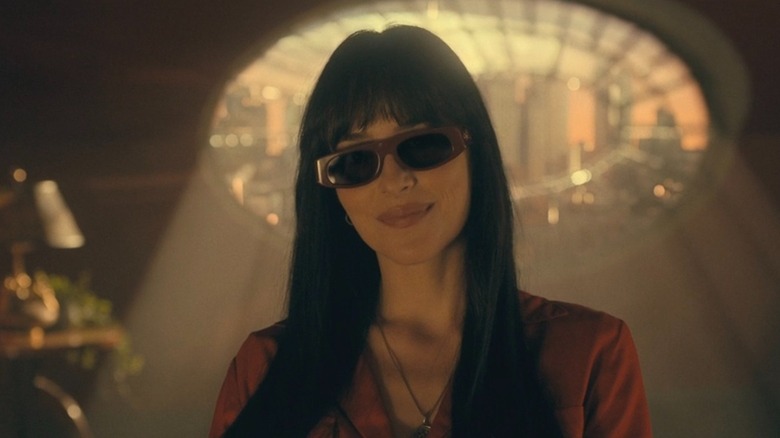 Madame Web donning a pair of shades indoors in Madame Web