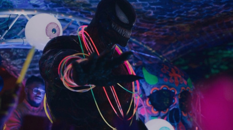 Venom dropping the mic at a club in Venom: Let There Be Carnage