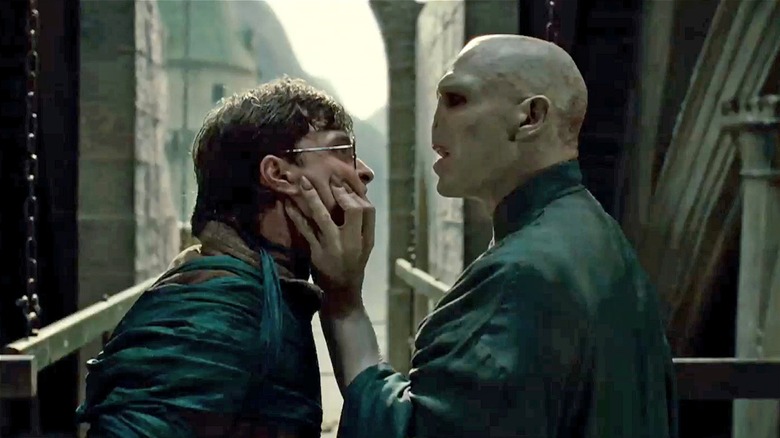 Voldemort grabbing Harry's face in Harry Potter and the Deathly Hallows