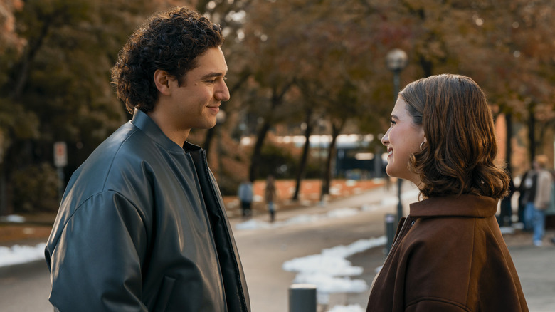 Hannah and Garrett facing each other and smiling on Off Campus