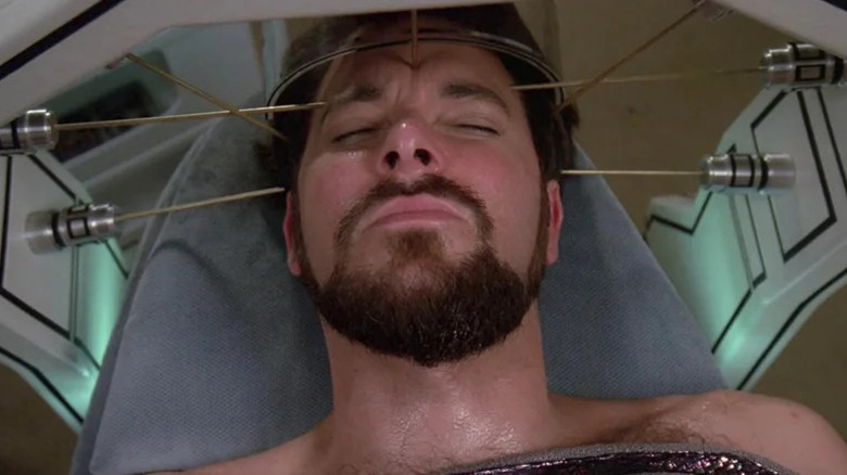 William Riker lying on an operating table with needles pointing at his head on Star Trek: The Next Generation
