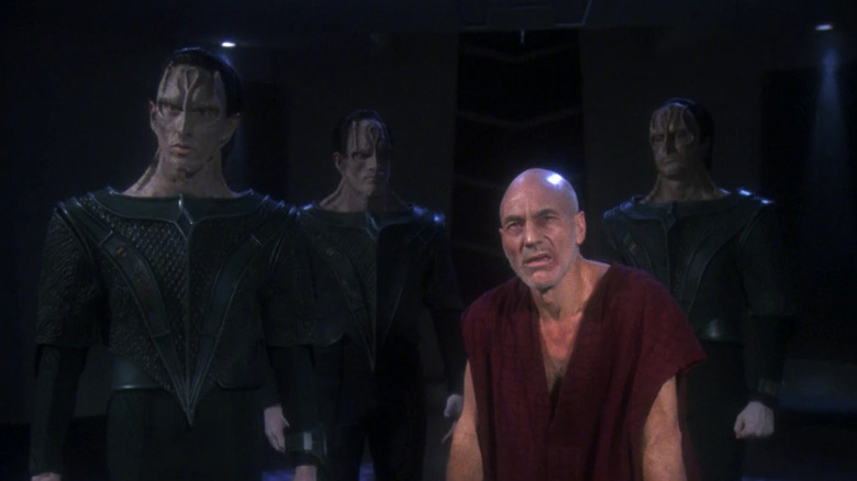 An anguished Picard with three Cardassians on Star Trek: The Next Generation