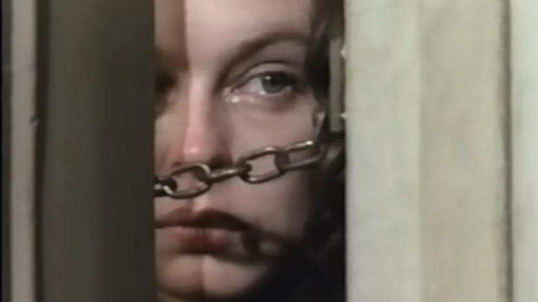 Marjorie Worden behind a locked door in Something Evil