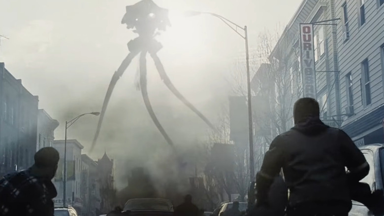 Ray Ferrier looking at a menacing tripod alien ship in War of the Worlds