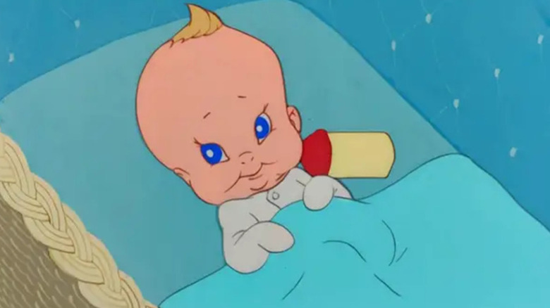 A baby lies in a cradle in "So Much for So Little"