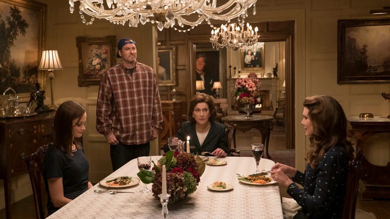 Rory Lorelai and Emily eating dinner with Luke standing near the table on Gilmore Girls