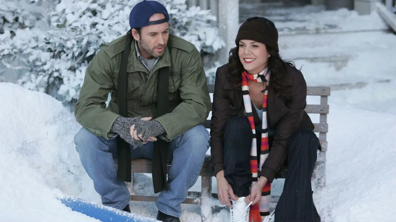 Luke and Lorelai preparing to skate on her ice rink in Gilmore Girls