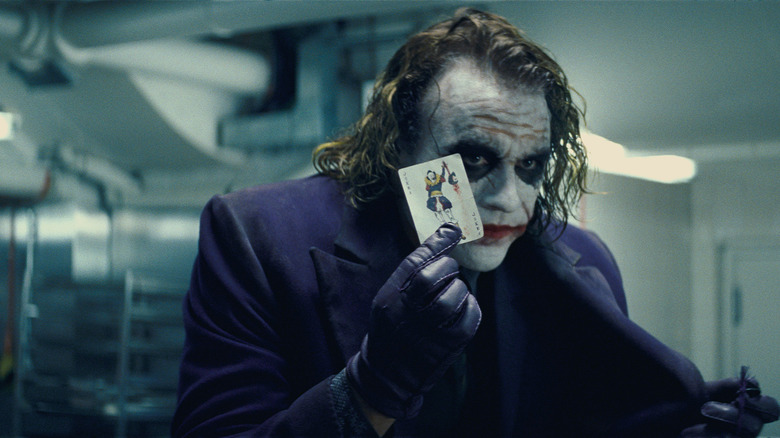 The Joker presenting his card in "The Dark Knight"