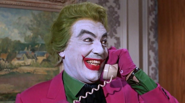 The Joker holding a phone in 