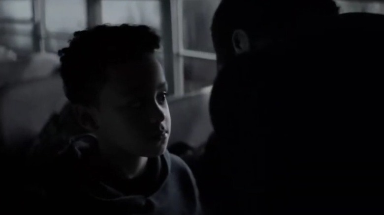 The Joker looming over an adolescent Marquis in "Batwoman"