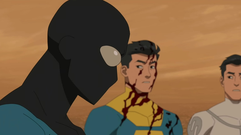 Masked Invincible leaning his head forward in Invincible Season 3