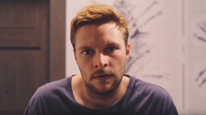 Christian stares off