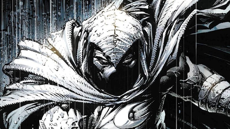 Moon Knight stands in the rain