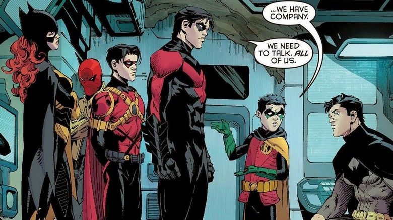 Batman meeting with current and former sidekicks