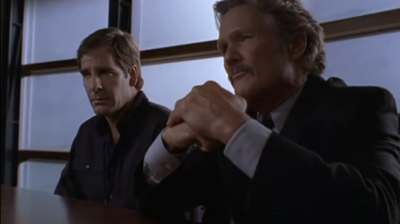 Alex and Steve sit at a table in "NetForce"