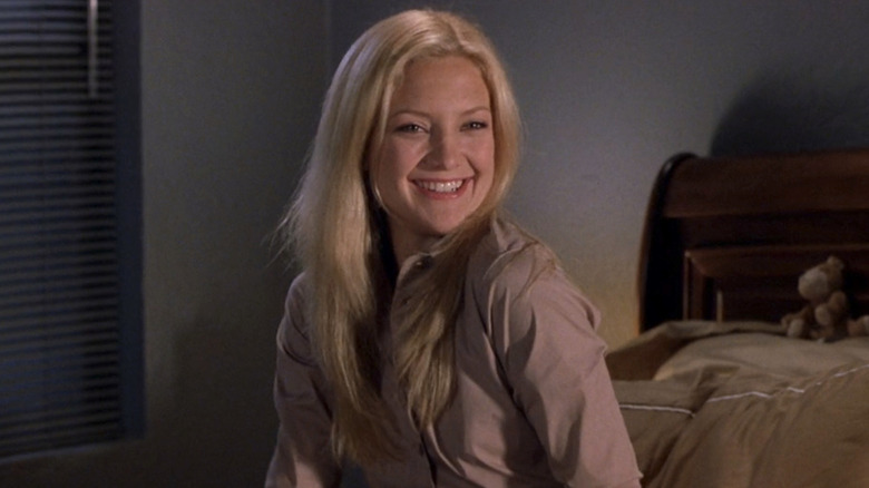 Andie Anderson sits on bed