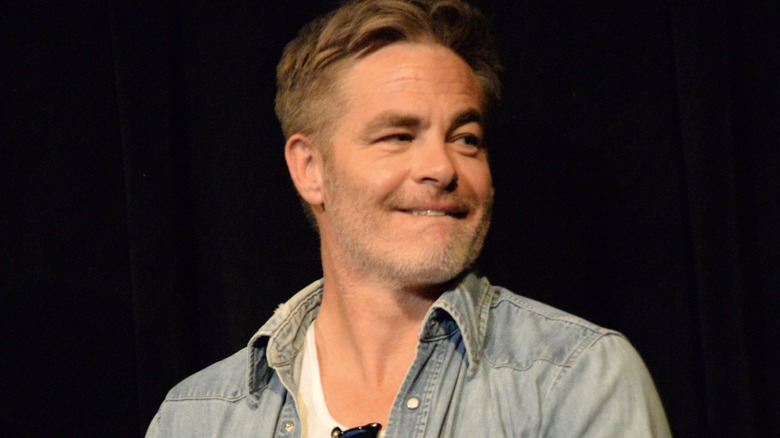 Chris Pine biting his lip onstage at the "Alpha Gang" premiere at 2026 Telluride Film Festival