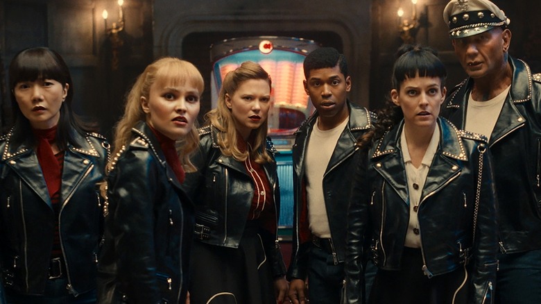 The Alpha Gang standing in front of their jukebox in 