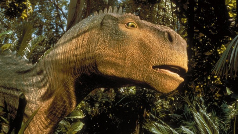 Aladar peeking through some trees