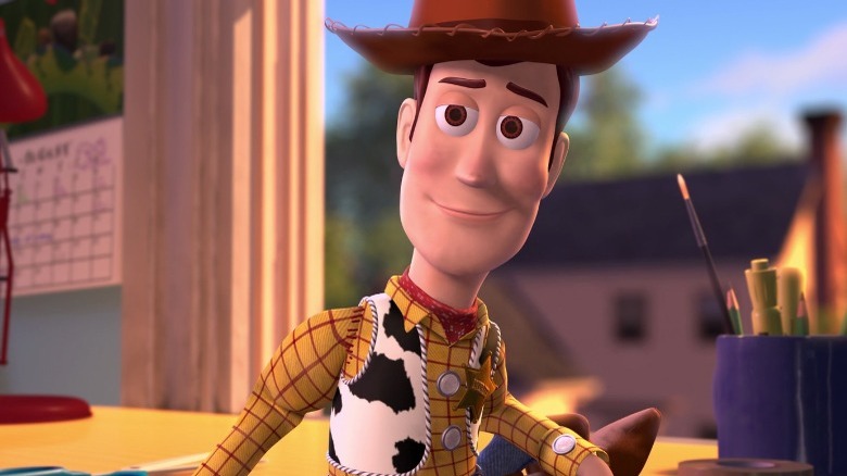 Woody sitting with a goofy smile
