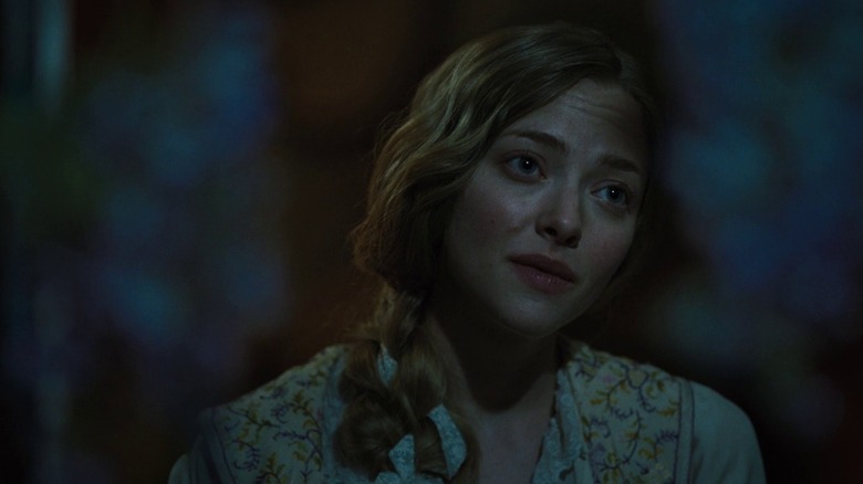 Cosette tilting her head at night in Les Misérables