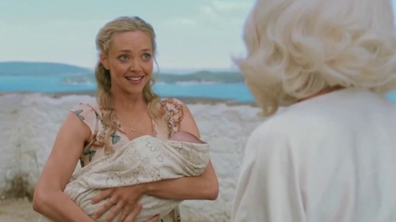Sophie holding her baby in Mamma Mia! Here We Go Again