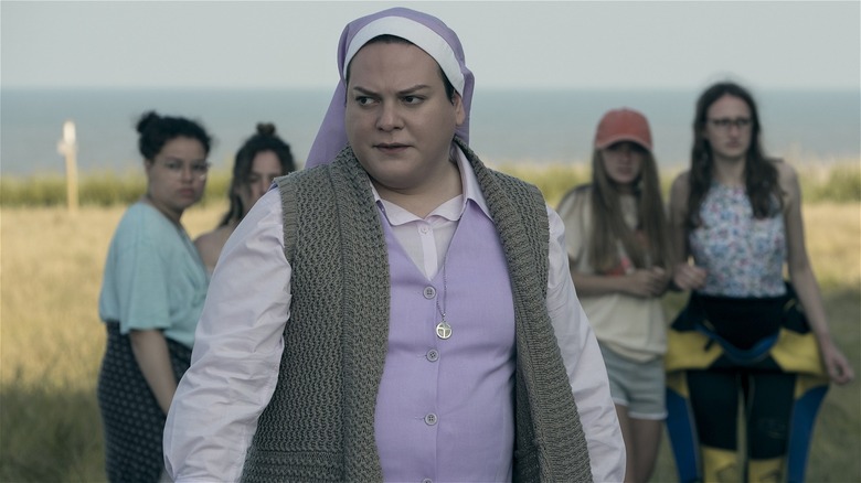 Sister Maria standing in a field with the girls