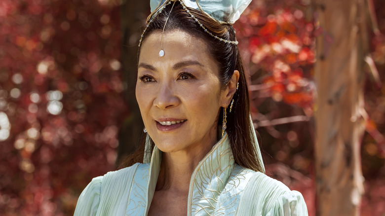 Guanyin standing in red forest