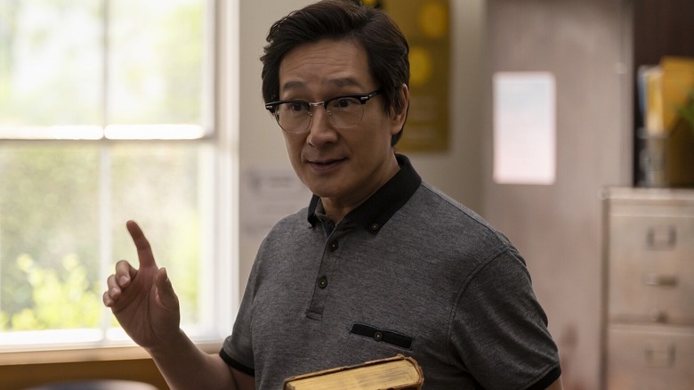 Jamie Yao holding a book