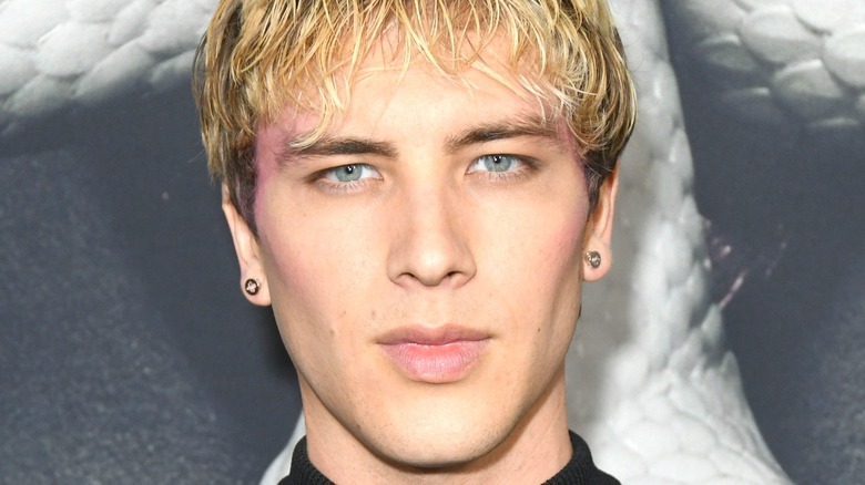 Cody Fern with blonde hair posing