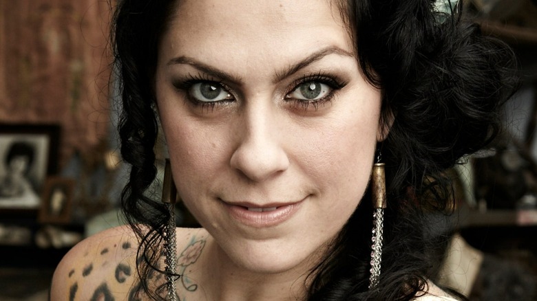 Danielle Colby smirking