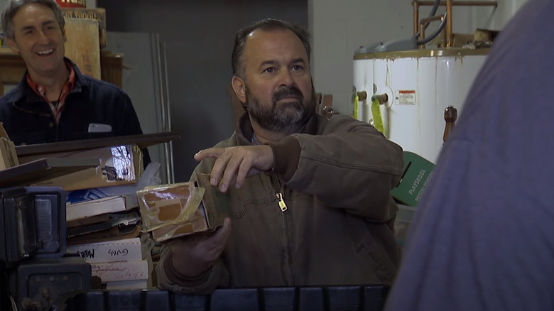 Frank Fritz holding a toy truck in a box