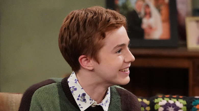 Ames McNamara smiling during a scene