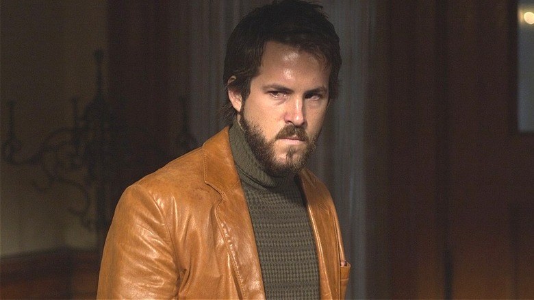 George Lutz glaring while wearing a brown leather jacket (2005)