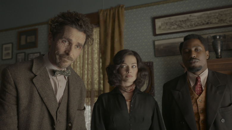 Burt and Harold looking forward while Valerie looks at Burt