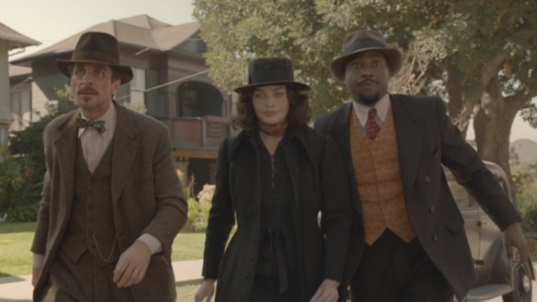 Burt, Valerie, and Harold crossing the street