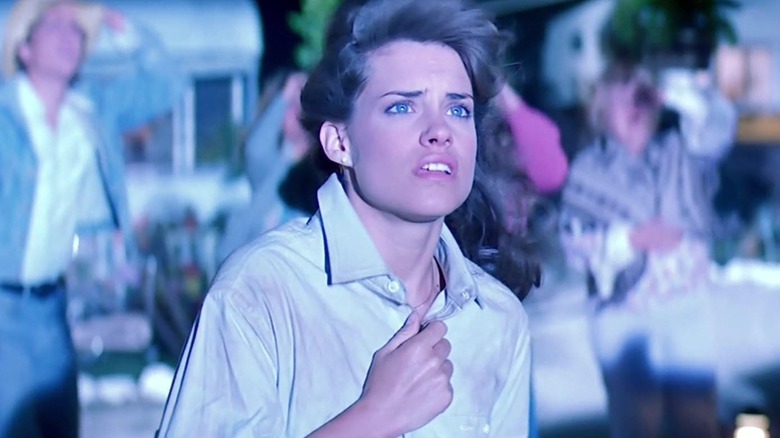 Maggie bathed in light as wind blows her hair in The Last Starfighter