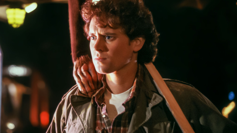 A hand grabs Alex on the shoulder in The Last Starfighter